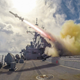 Illustration for article titled A US Navy guided-missile destroyer fires a Harpoon missile in this bad ass photo